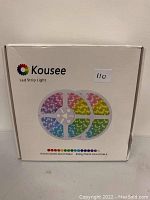 Front of the Kousee LED strip light box showing brand logo and color images of the LED strip light in RGB color segments.