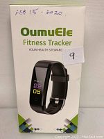 Front of OumuEle Fitness Tracker box showing product image and branding.