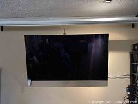 Front view of TV mounted on wall