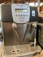 Front view of the Starbucks Barista Italia Digital espresso machine with control buttons and LCD display.