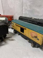 Close-up of Baby Ruth boxcar and adjacent train cars.