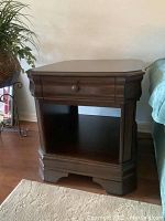 Front view of first end table showing drawer and shelf