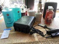 Photo showing personal grooming products including Life Ocean Breeze bath soaps and shower gels, Wahl hair trimmer in hard case, white vanity set container and other bottles