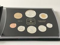 Full view of the proof coin set in original plastic case with black background showcasing nine Canadian coins.
