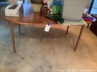 Wide angle of the dining table from the side with various items on top