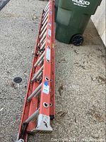 Full view of ladder retracted on driveway