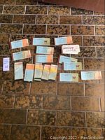 Full overview of all vintage Disneyland tickets and booklets spread on floor.