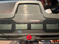 Close-up of the Bowflex TreadClimber console showing the digital display windows and safety key.