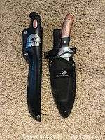 Two fixed blade knives side by side, one with black plastic handle and Rapala sheath, the other with wooden handle and Winchester sheath.