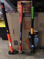 All three tools displayed standing upright, showing handles and heads