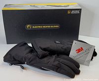 Photo showing Aroma Season electric heated gloves with box and 3M Thinsulate tag visible, gloves are black, lightly padded, size small and new in packaging.