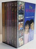 Photo of The Wonder Years Complete Series DVD box set showing spines of all five season DVD cases and slipcase box with cover art.