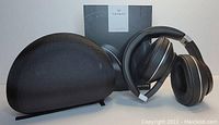 Vankyo C751 wireless headphones in black with memory protein ear pads, foldable ear cups, and silver accents. Includes a black textured semi-rigid protective case and a branded box in the background.