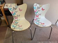 Front and angled side view of both chairs showcasing butterfly design and chrome legs.
