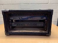 Front view of the rack with 482i Sonic Max, Alesis MicroVerb 4, and Yamaha GC2020B compressor visible