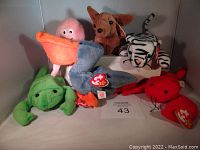 Six Ty Beanie Babies plush toys shown together with tags visible.