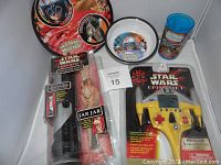 Child's Star Wars Episode 1 themed plate, bowl, and drinking cup with Jar Jar Binks figure and Starfighter watch in packaging.