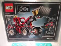 Front view of the LEGO Technic Telehandler set 8283 box showing full assembled vehicle with lifting bucket and demo alternate builds.