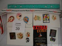 Group photo of 8 Disney collectible pins arranged on lined paper with a ruler and lot number card, showing designs related to Walt Disney World's media exclusives and music events.