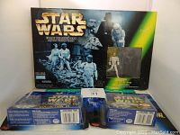 Front view of Star Wars Micro Machines Death Star boxed set with figures visible in window and box art showing stormtroopers and spaceships.