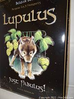 Close-up photo showing detailed artwork of the wolf and hops with Lupulus branding