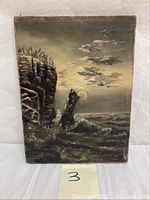 Full front view of the antique oil painting showing the cliff, rock, waves, and cloudy sky on canvas.