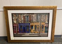 Full view of framed lithograph in gold-tone frame with white mat