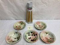Full set of one hexagonal vase and five scalloped fruit bowls arranged on a neutral surface