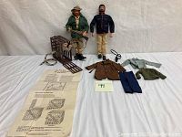 Full view of lot showing two G.I. Joe figures, clothing, cage with white tiger, and instructions.