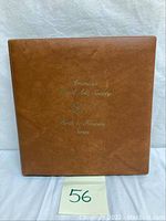 Brown binder album cover titled 'American Postal Arts Society Birds & Flowers Series'