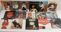 Full view of 16 vintage vinyl record albums with various artists including Diana Ross, Phil Collins, Benatar, and soundtracks.