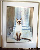 Front view of framed watercolor painting showing two Siamese cats and fluted column