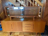 Front view of teak buffet and hutch set assembled together