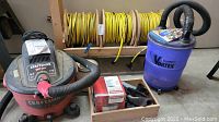 Overview showing cords on cart, Craftsman vac, Vortex separator, attachments in wooden tray