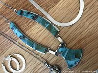 Overview of all jewelry items on wood background