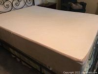 Assembled queen mattress and power base in bedroom