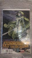 Front cover of the comic book showing the illustrated female character with sword and the Guardians of the Galaxy title.