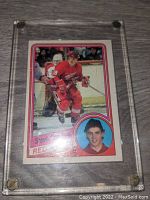 Front view of Steve Yzerman hockey card showing action photo and portrait, in hard plastic protective case.