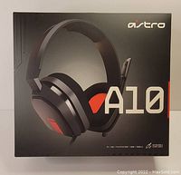 Front view of the Astro A10 wireless gaming headset box showing the product image, brand, and compatibility with PC, Mac, PlayStation, Xbox, and mobile.