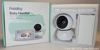 Pelaby Baby Monitor Model HM8666A with camera unit, handheld monitor, charging cables, and original packaging box.