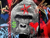 Close-up front view showing central fingerprint motif, red star and heart details