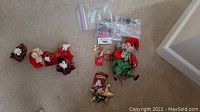 Wide view showing entire lot of Christmas decorations including elf, rabbits, bells, star ornament