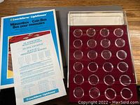 Two sets of Leuchtturm Lighthouse MB80 Coin Boxes with clear lids and manuals. Each box has 40 circular coin compartments.