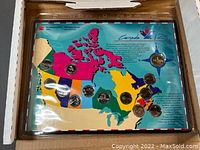 Canada 125 anniversary coin set inside original packaging showing map and coin placements