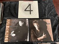 Front side of all three LP vinyl albums showing Foreigner '4' and two Don Henley albums.