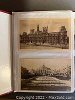 Photo showing two vintage sepia tone postcards in protective sleeves inside binder, featuring Paris landmarks including Hotel de Ville.