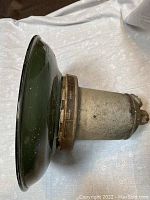 Side view of the Killark explosion proof light showing conical reflector and aluminum housing.