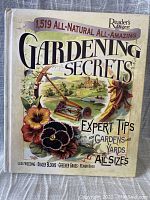 Front cover of gardening book showing title, author, and colorful gardening illustration