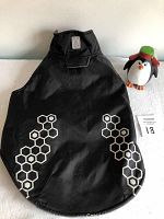 Black medium dog vest with hexagon reflective pattern, Velcro closure at neck
