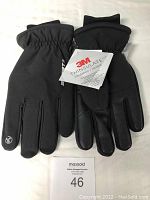 Front and back view of black men's winter gloves with 3M Thinsulate tag attached showing insulation properties and SPORT-1 branding.